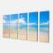 Designart - Large Clouds Over Calm Beach - Seashore Photo Canvas Print